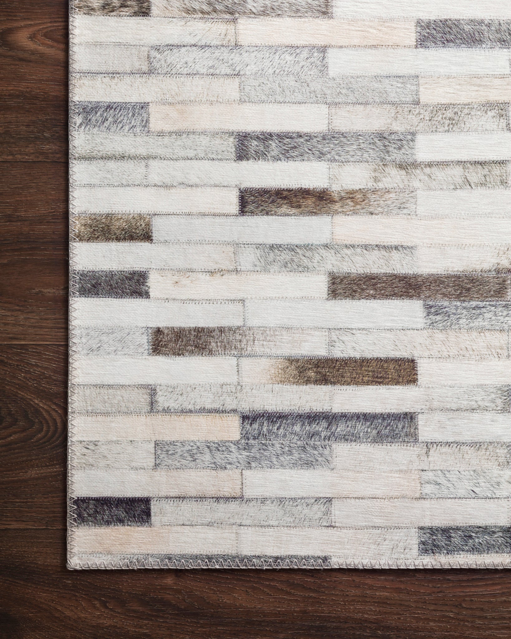 Maddox Ivory / Grey shown from a different angle to reveal its pattern.