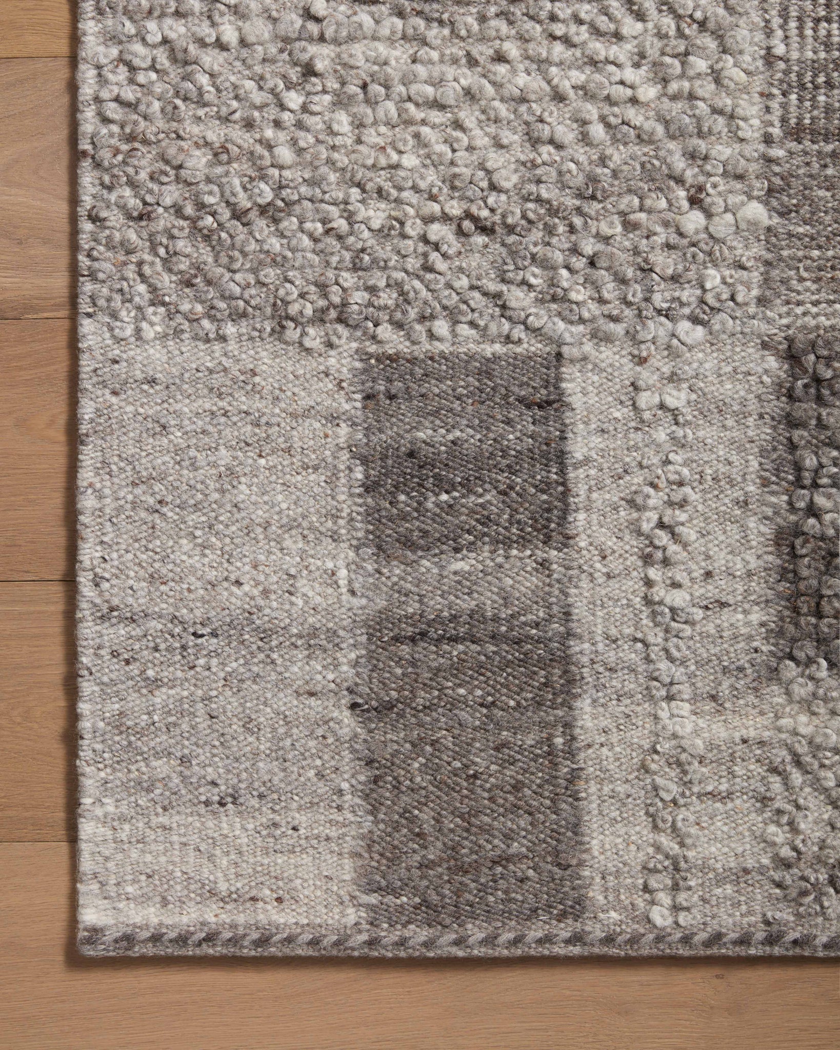 Manfred Charcoal / Dove shown in a styled living room vignette at Laurie Yapp Home.