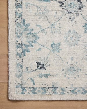 Marcella Blue / Ivory shown from a different angle to reveal its pattern.