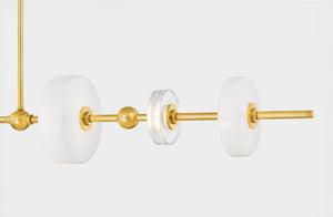 Maynard Linear in aged brass shown from the front to reveal the extended frame and shade array.