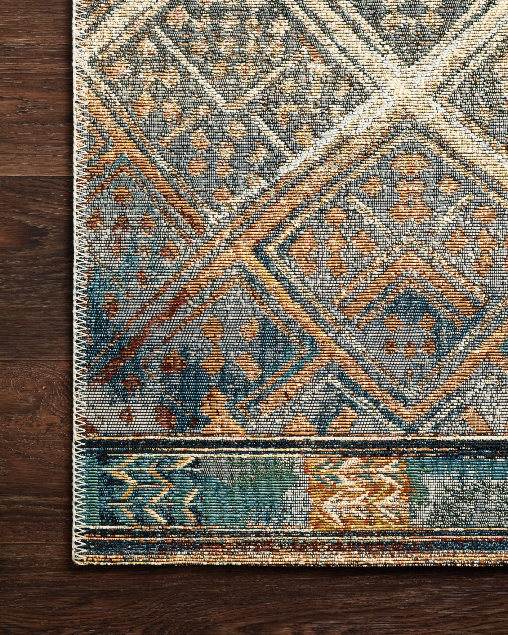 Close-up detail of the Mika Ivory / Mediterranean showing its pile and weave.