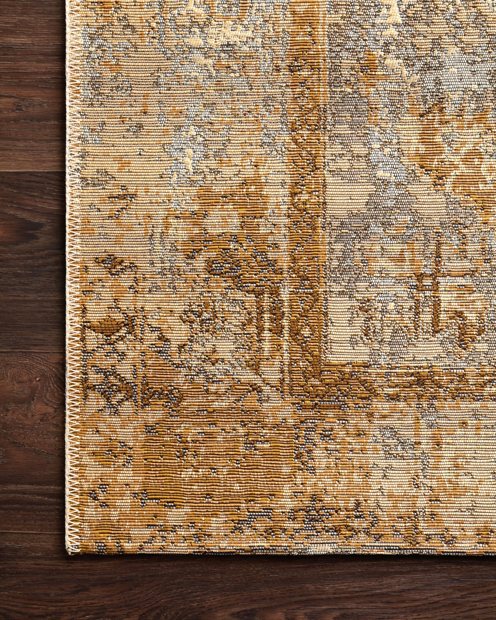 Close-up detail of the Mika Ant. Ivory / Copper showing its pile and weave.