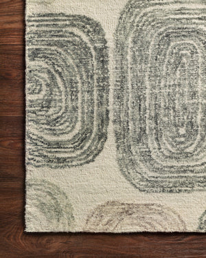 Side view of the Milo Dk. Grey / Neutral rug.