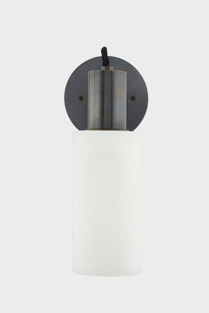 Close-up of the Malba Wall Sconce in dark bronze showing the arm curve and shade silhouette.
