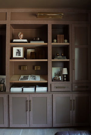 Merrick Picture Light 24.5" in aged brass styled in a gallery wall for warm, layered light at Laurie Yapp Home.