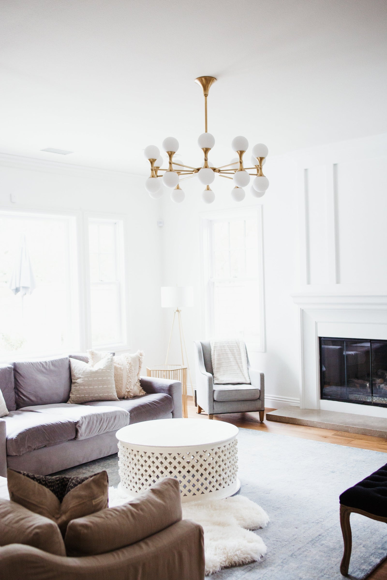 Astoria Chandelier 36" in aged brass — a Hudson Valley chandelier for dining rooms, entries, and living rooms at Laurie Yapp Home.