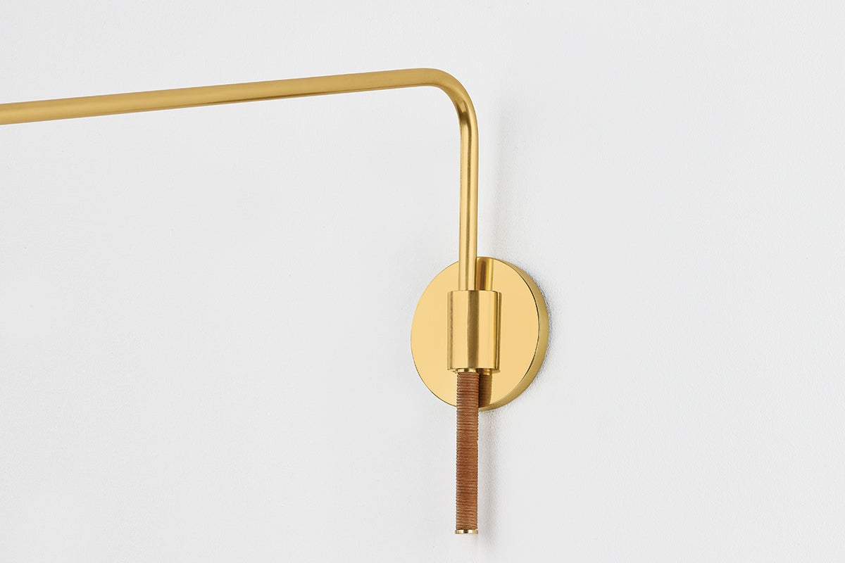 Narragansett Wall Sconce in aged brass shown from the front to reveal the arm curve and shade silhouette.