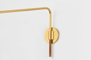 Narragansett Wall Sconce in aged brass shown from the front to reveal the arm curve and shade silhouette.