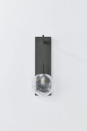 Close-up of the Onteora Wall Sconce in dark bronze showing the arm curve and shade silhouette.