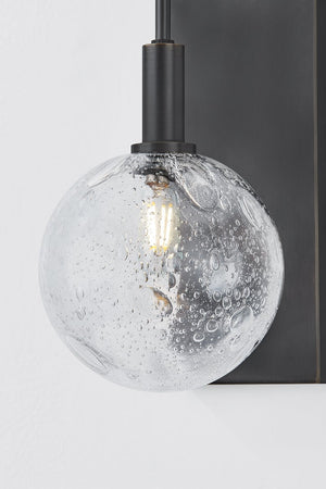 Close-up of the Onteora Wall Sconce in dark bronze showing the arm curve and shade silhouette.