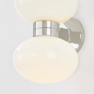 Close-up of the Otsego Wall Sconce in polished nickel showing the arm curve and shade silhouette.
