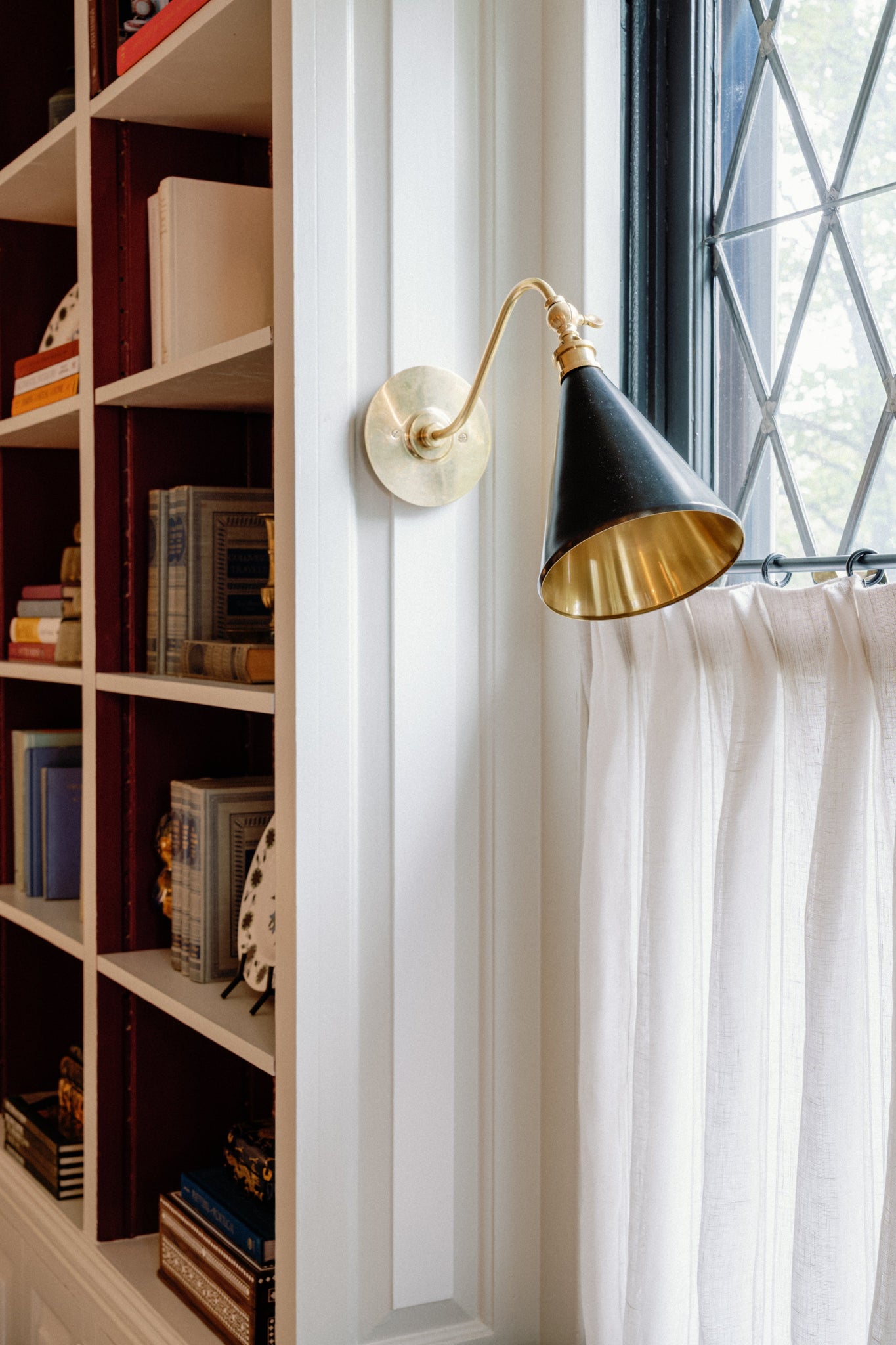 Osterley Wall Sconce 6.5" x 11" styled in a modern bathroom for warm, layered light at Laurie Yapp Home.