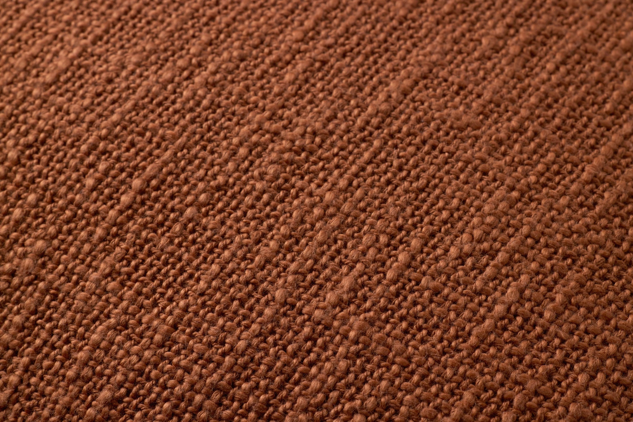 Terracotta Pillow shown from a different angle to reveal its pattern.