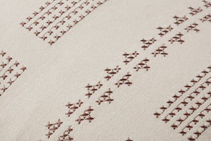 Thomas Natural Pillow shown from a different angle to reveal its pattern.