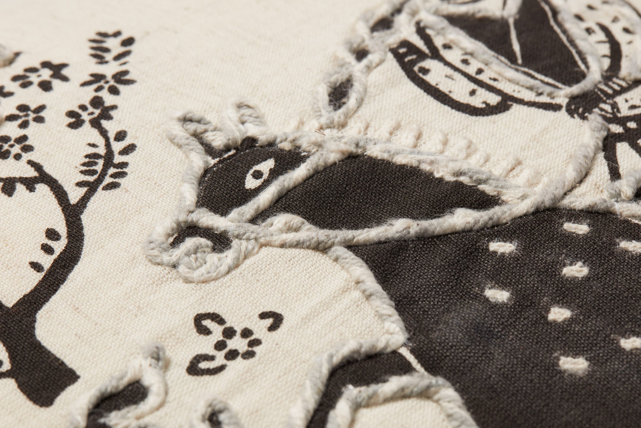 Ivory / Black Pillow shown from a different angle to reveal its pattern.