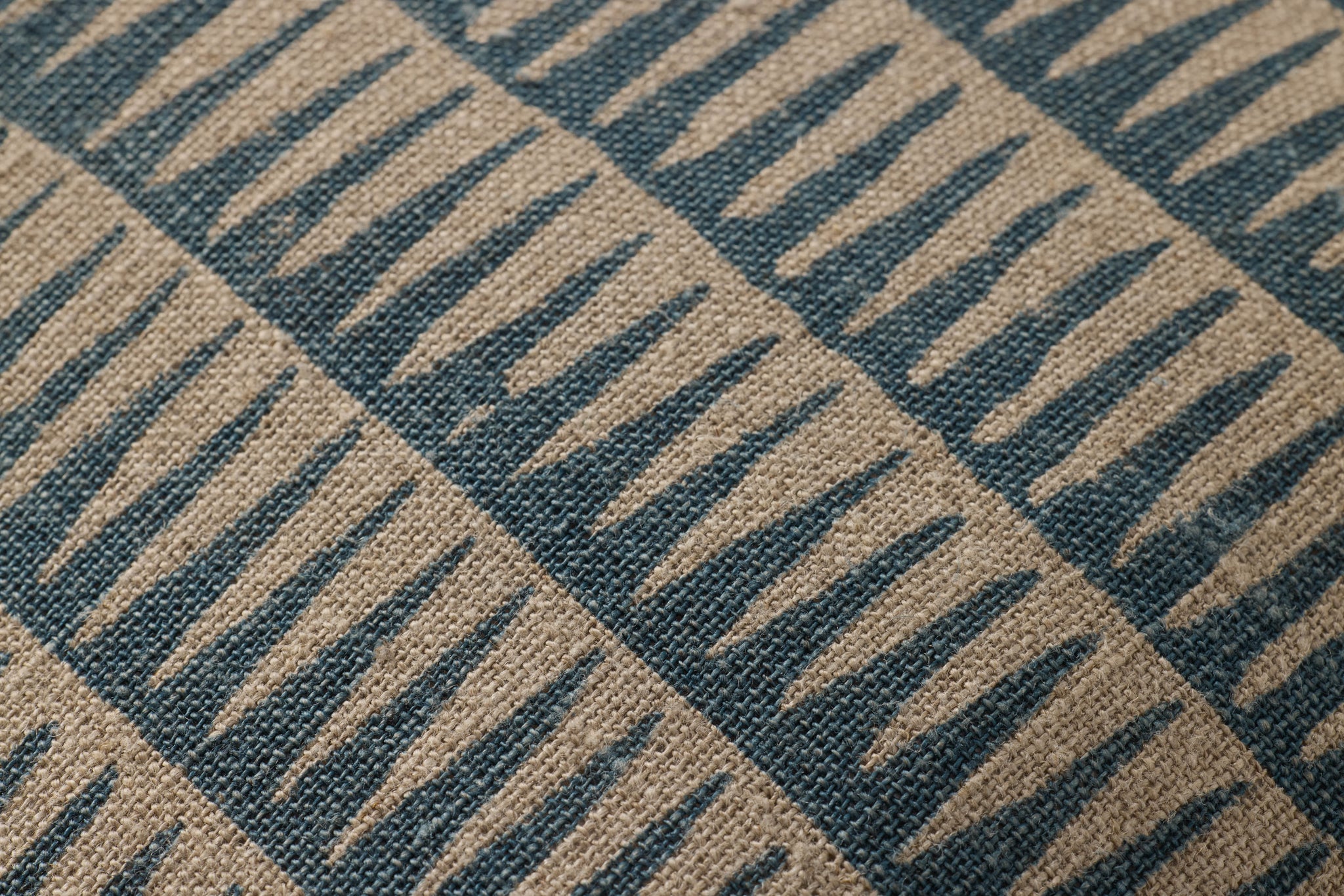 Natural / Blue Pillow shown from a different angle to reveal its pattern.