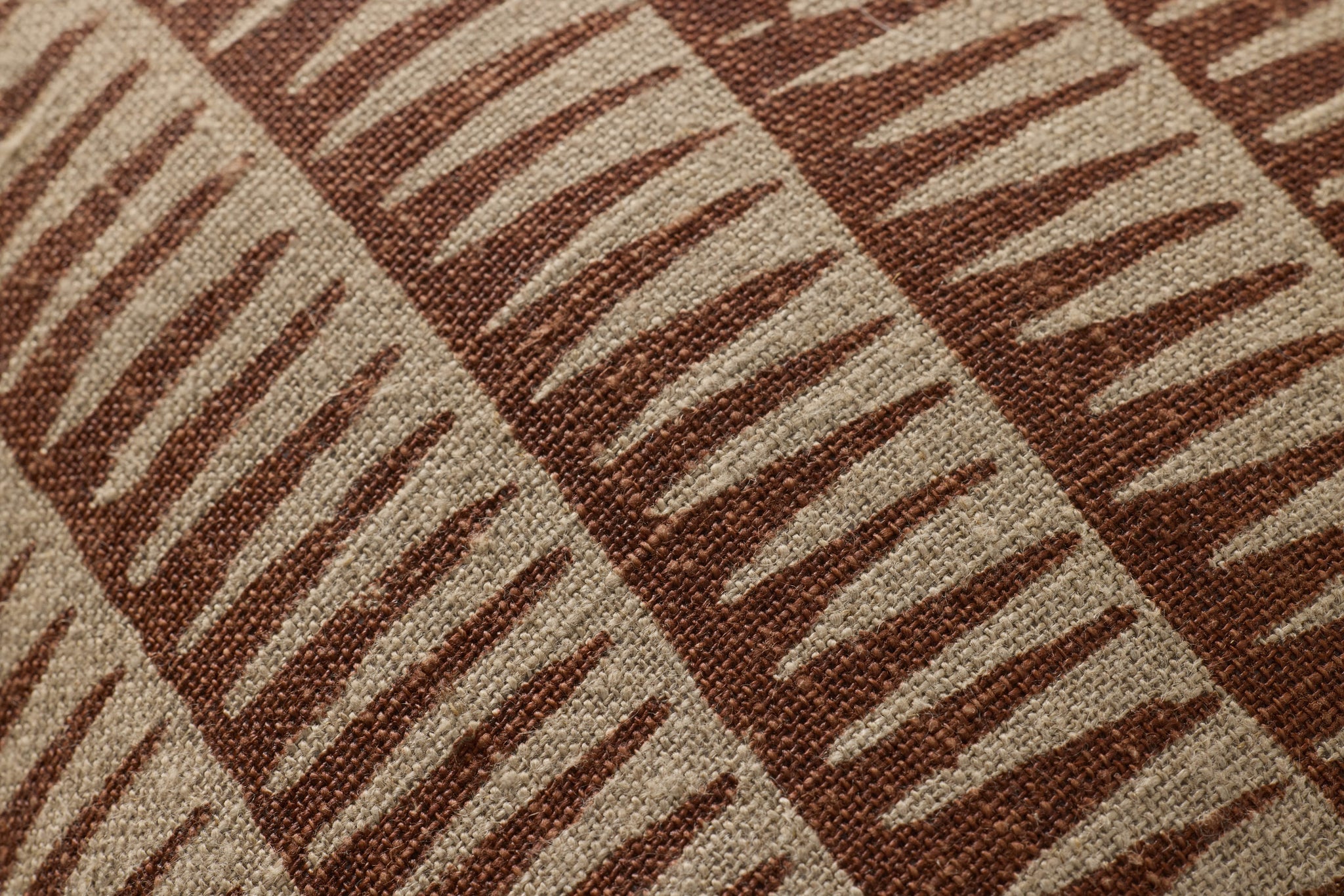Natural / Rust Pillow shown from a different angle to reveal its pattern.