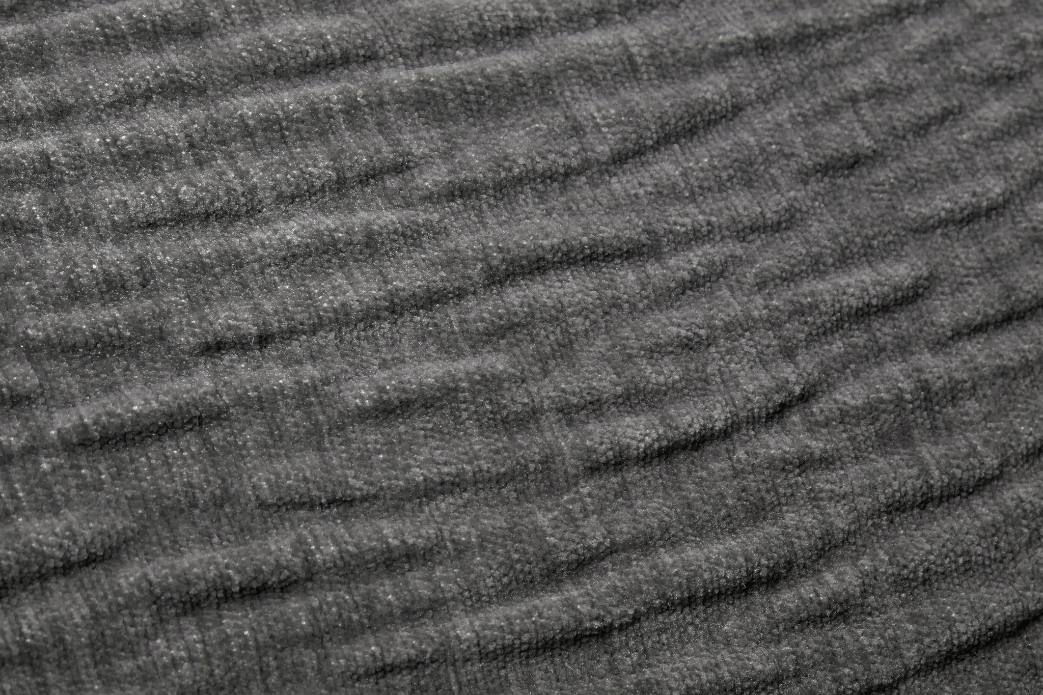 Grey Pillow shown from a different angle to reveal its pattern.