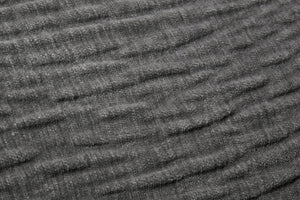 Grey Pillow shown from a different angle to reveal its pattern.