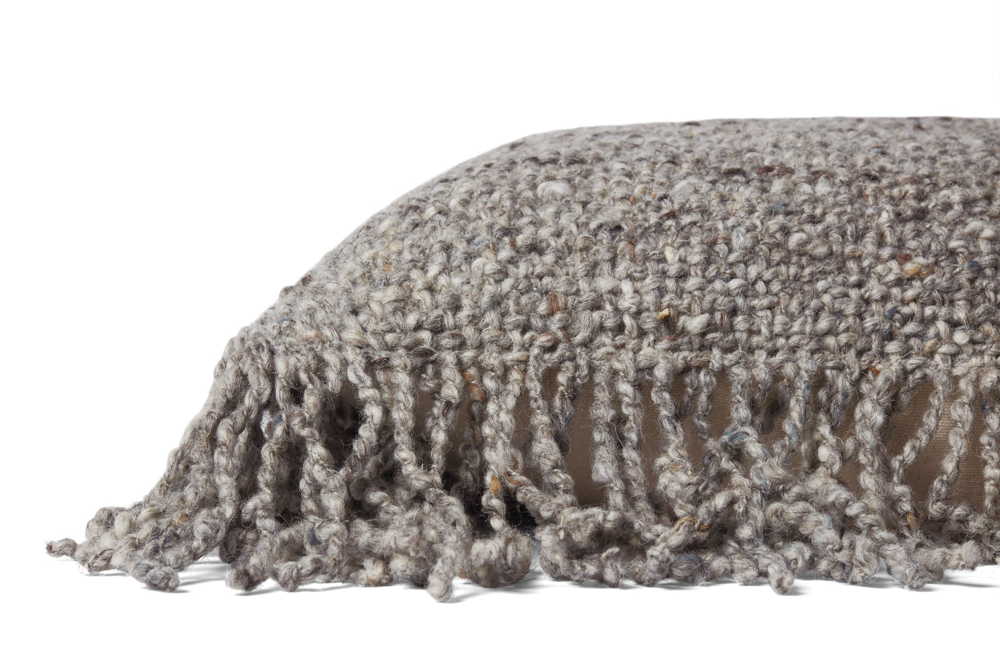 Beige Pillow shown from a different angle to reveal its pattern.