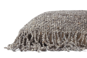 Beige Pillow shown from a different angle to reveal its pattern.