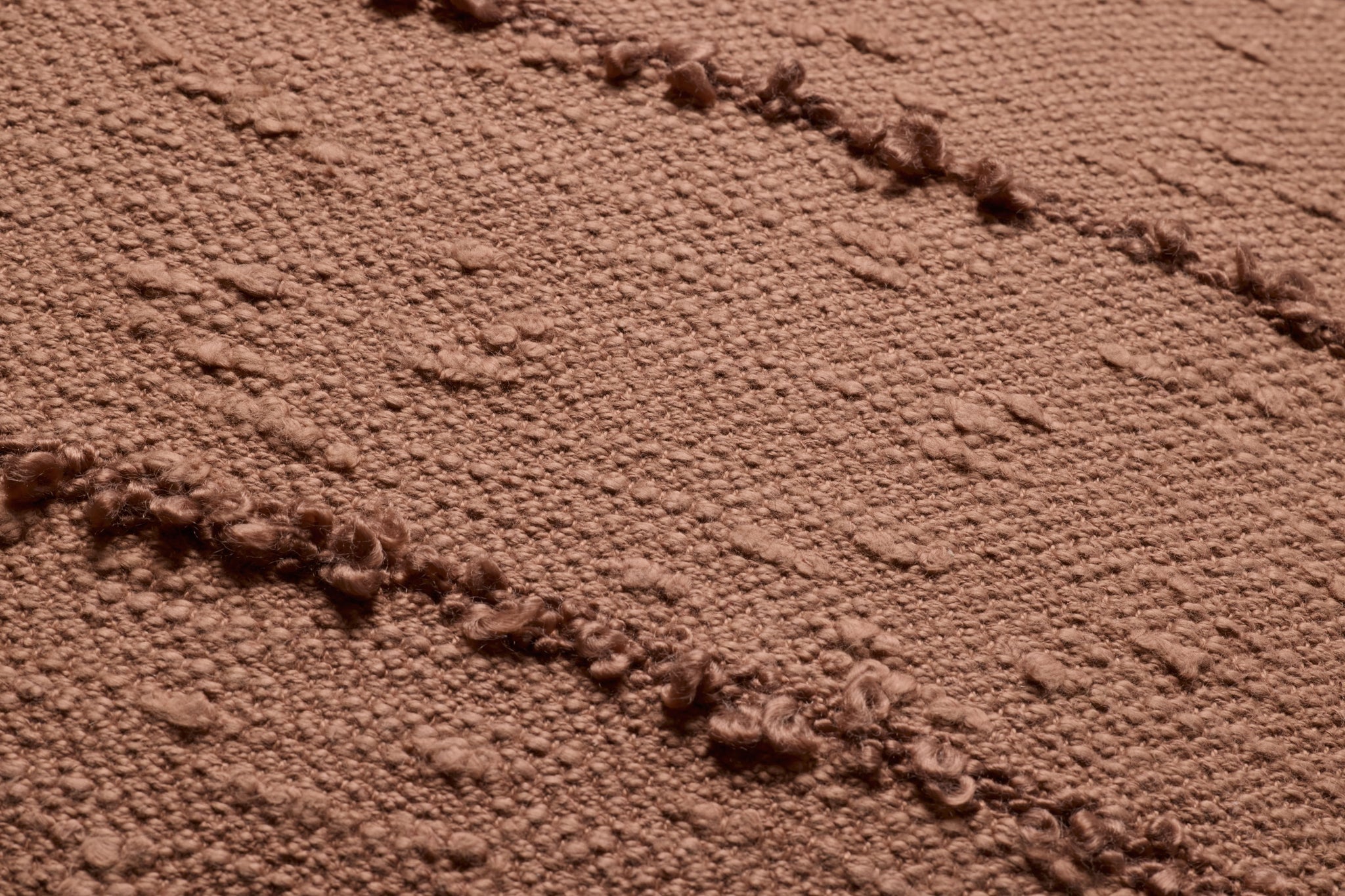 Rustic Brown Pillow shown from a different angle to reveal its pattern.