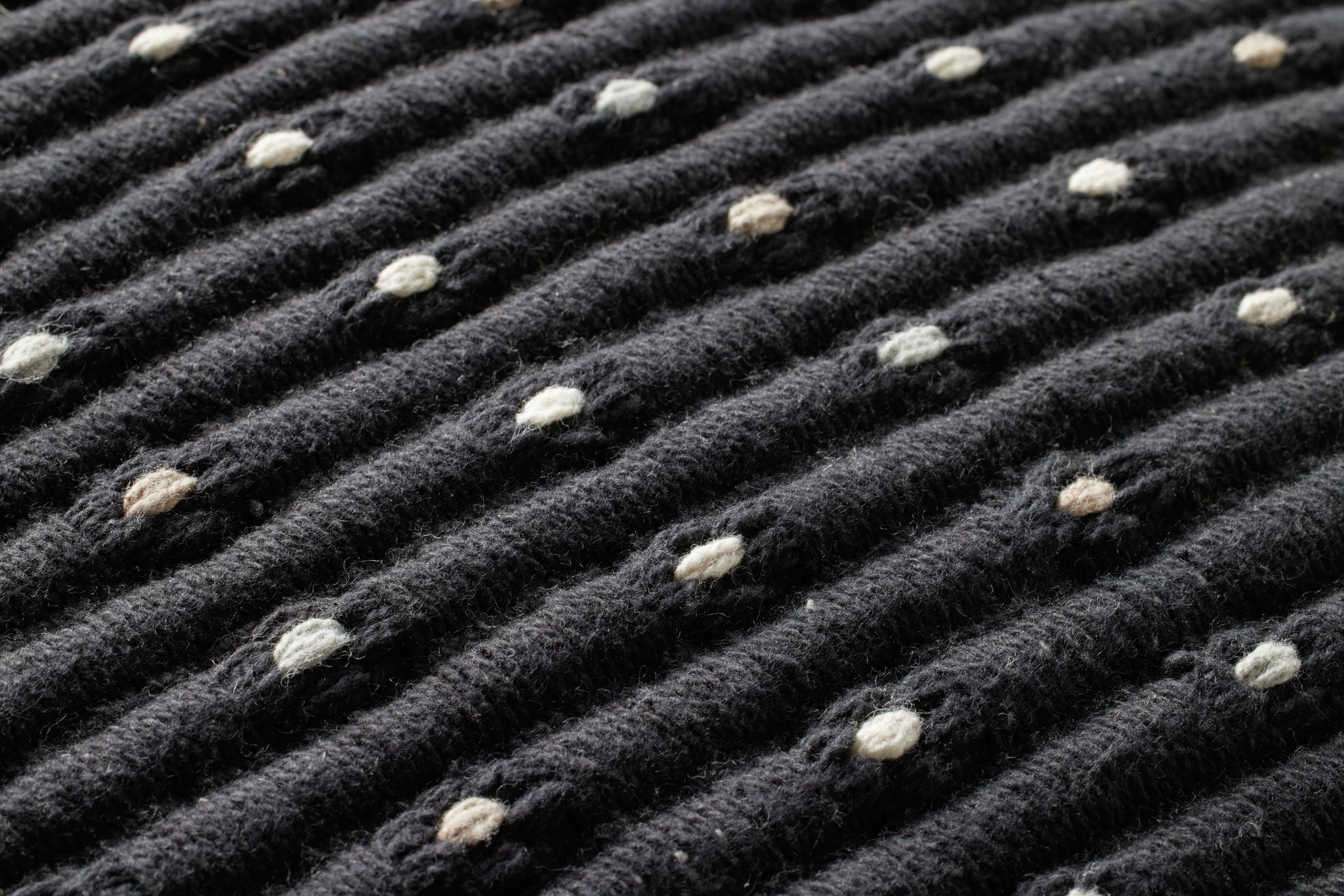 Black Pillow (Pattern 1) shown from a different angle to reveal its pattern.