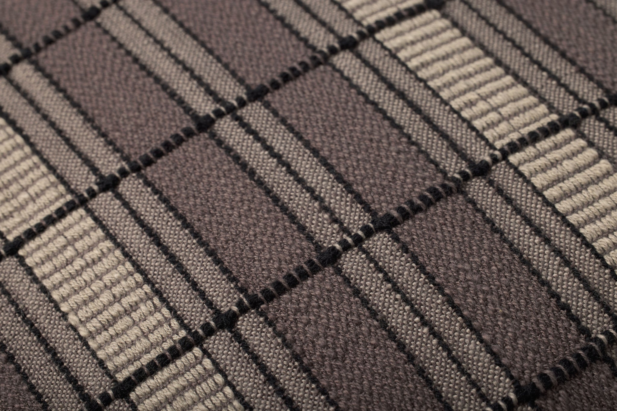 Brown / Beige Pillow shown from a different angle to reveal its pattern.