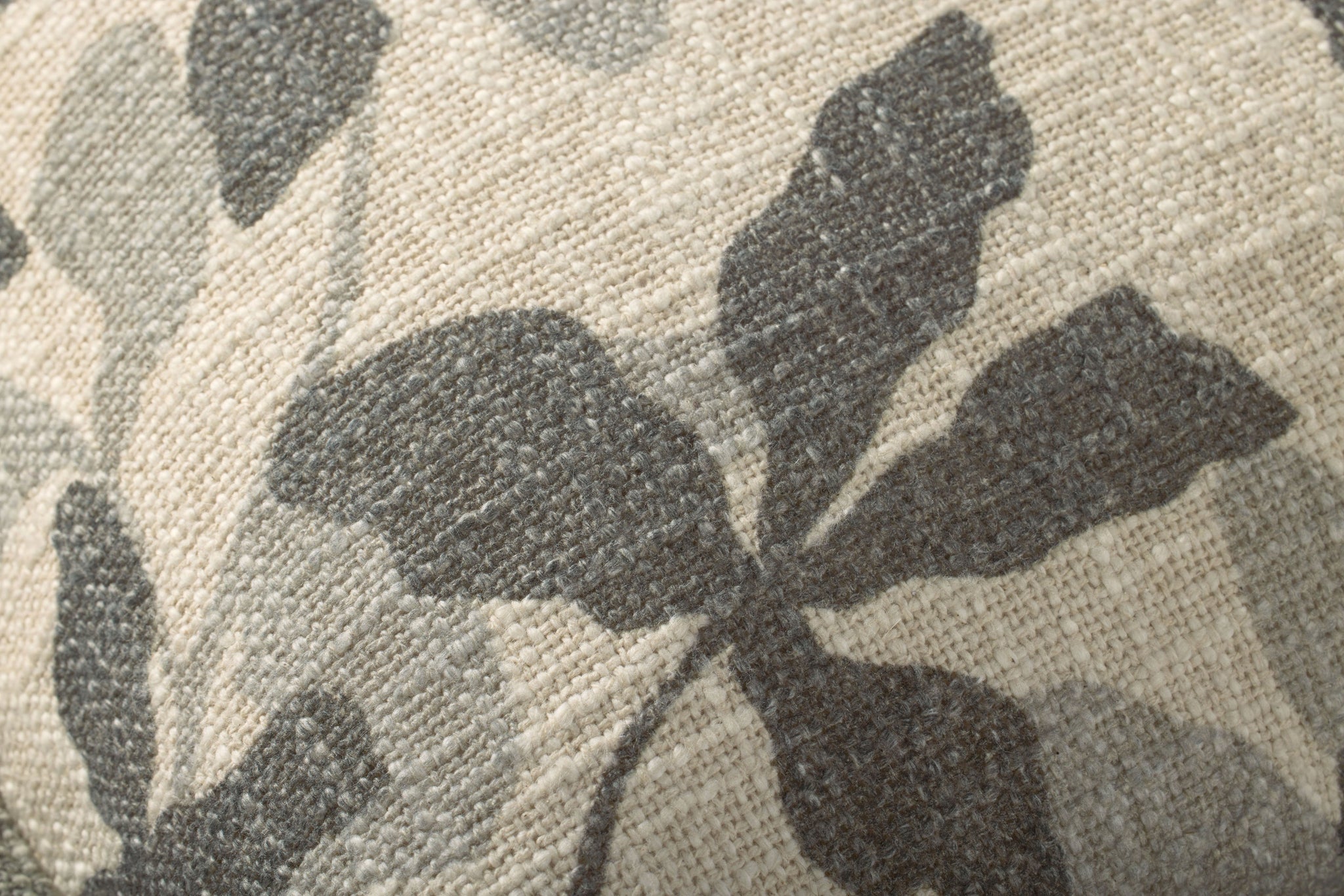 Charcoal / Natural Pillow shown from a different angle to reveal its pattern.