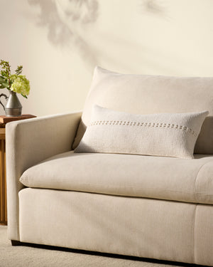 Harvey White Pillow shown from a different angle to reveal its pattern.