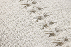 Harvey White Pillow shown from a different angle to reveal its pattern.