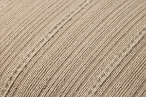 Howie Natural Pillow shown from a different angle to reveal its pattern.