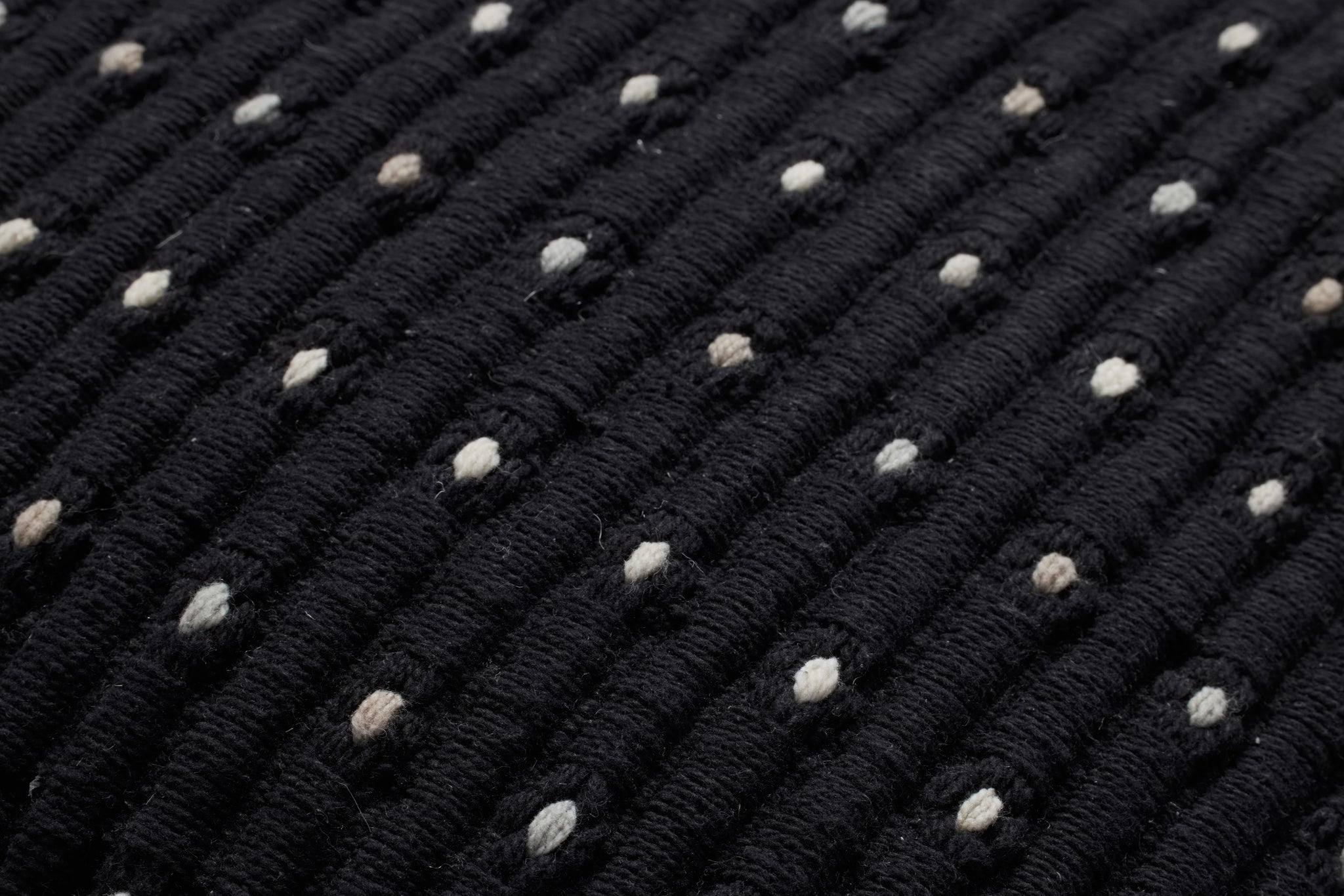 Black Pillow (Pattern 2) shown from a different angle to reveal its pattern.