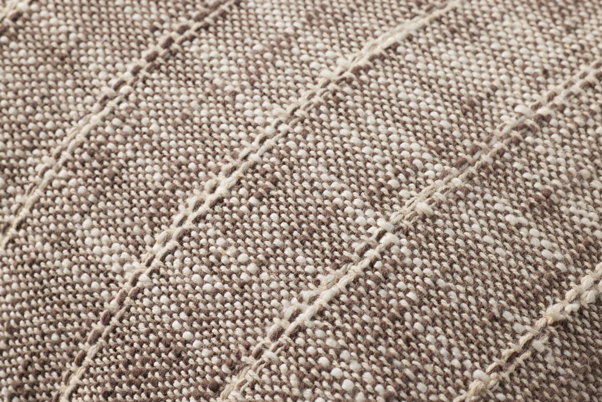 Brown / Ivory Pillow shown from a different angle to reveal its pattern.