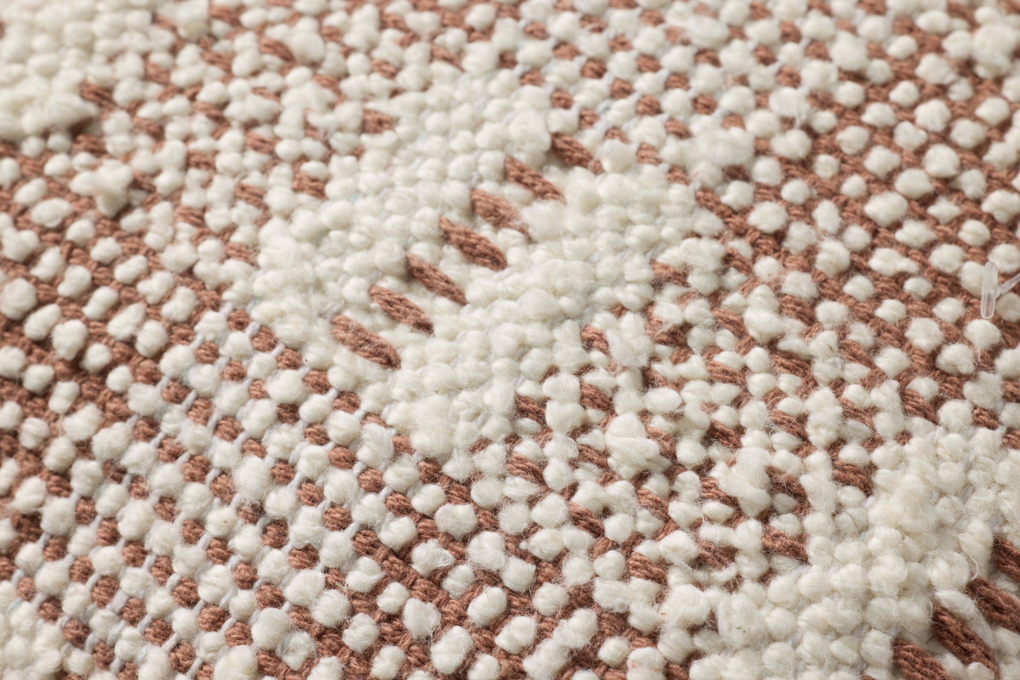 Ivory / Rust Pillow shown from a different angle to reveal its pattern.
