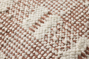Ivory / Rust Pillow shown from a different angle to reveal its pattern.