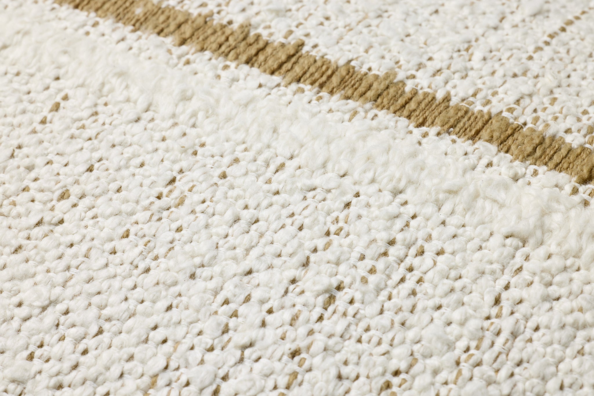 Ivory / Gold Pillow shown from a different angle to reveal its pattern.