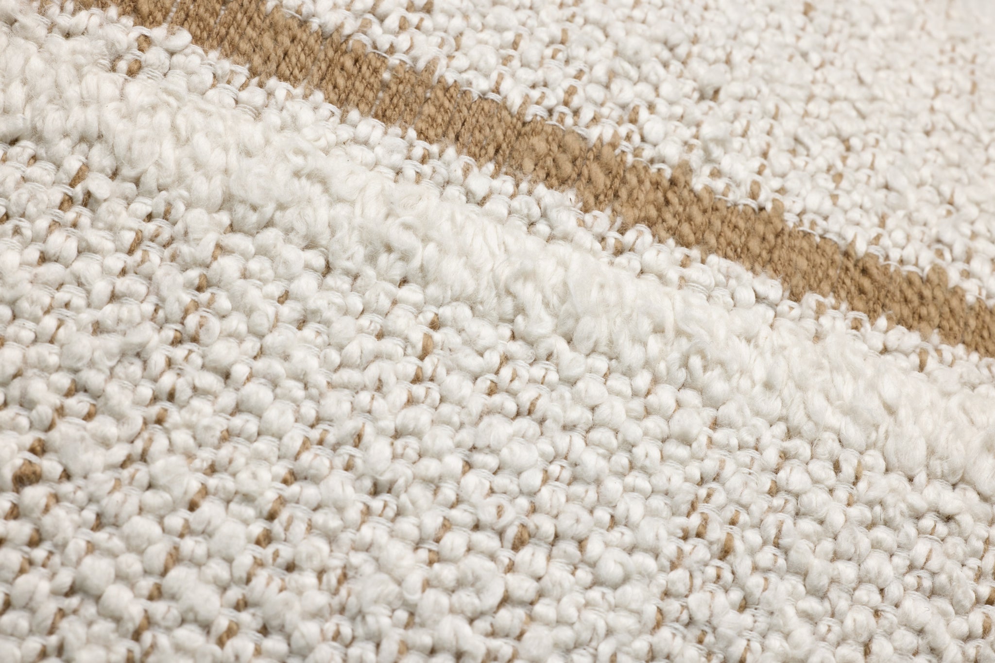 Ivory / Rustic Brown Pillow shown from a different angle to reveal its pattern.