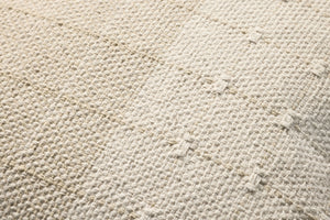 Beige / Natural Pillow shown from a different angle to reveal its pattern.
