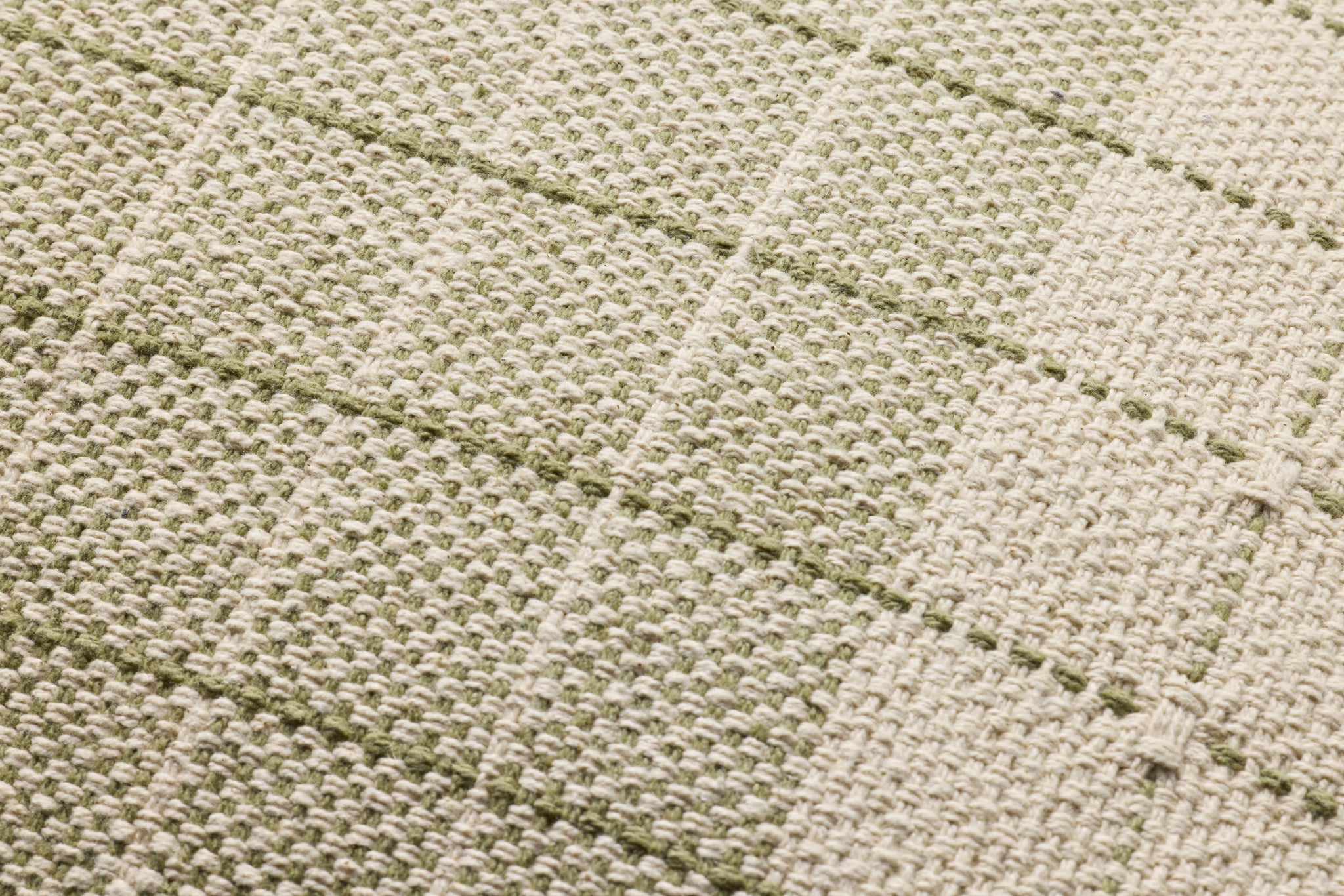 Green / Natural Pillow shown from a different angle to reveal its pattern.