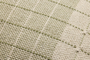 Green / Natural Pillow shown from a different angle to reveal its pattern.