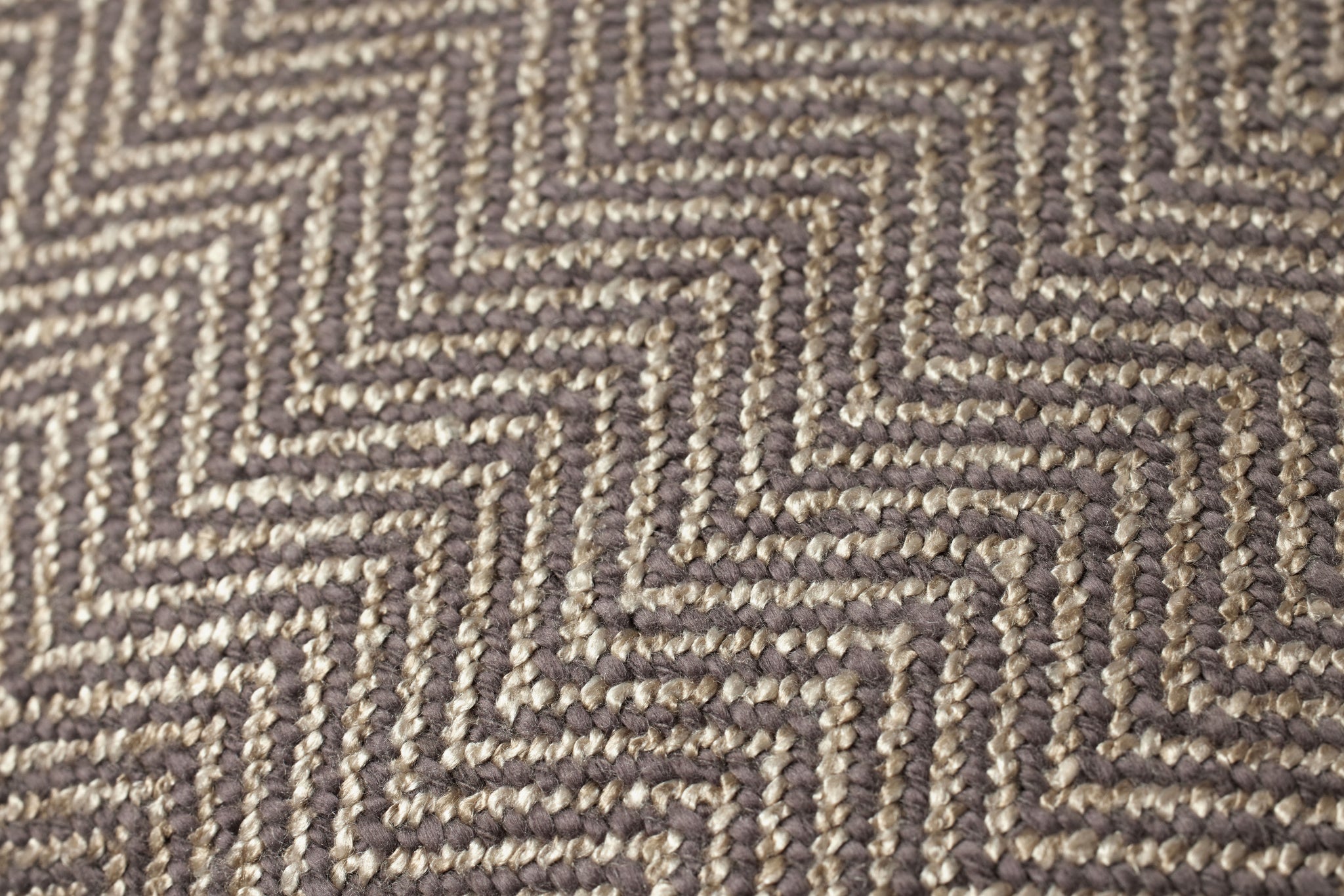 Dark Taupe Pillow shown from a different angle to reveal its pattern.