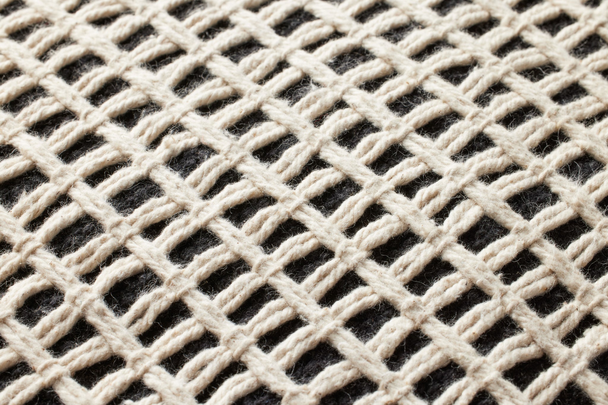 Black / Ivory Pillow (Pattern 6) shown from a different angle to reveal its pattern.