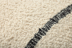 Natural / Charcoal Pillow shown from a different angle to reveal its pattern.