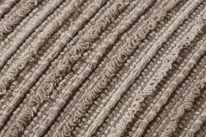 Maura Earth Pillow shown from a different angle to reveal its pattern.