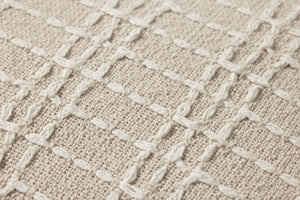 Beige / Ivory Pillow shown from a different angle to reveal its pattern.