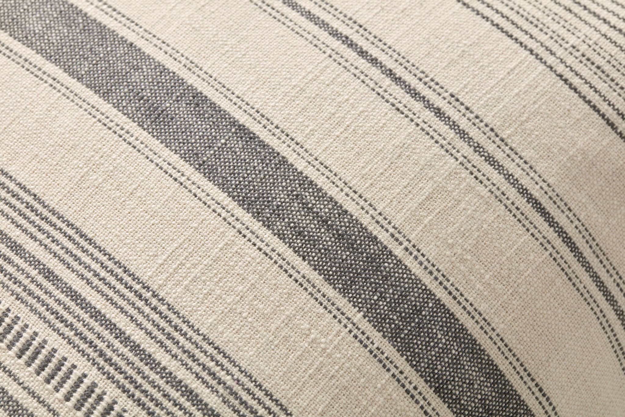 Celina Ivory / Grey Pillow shown from a different angle to reveal its pattern.