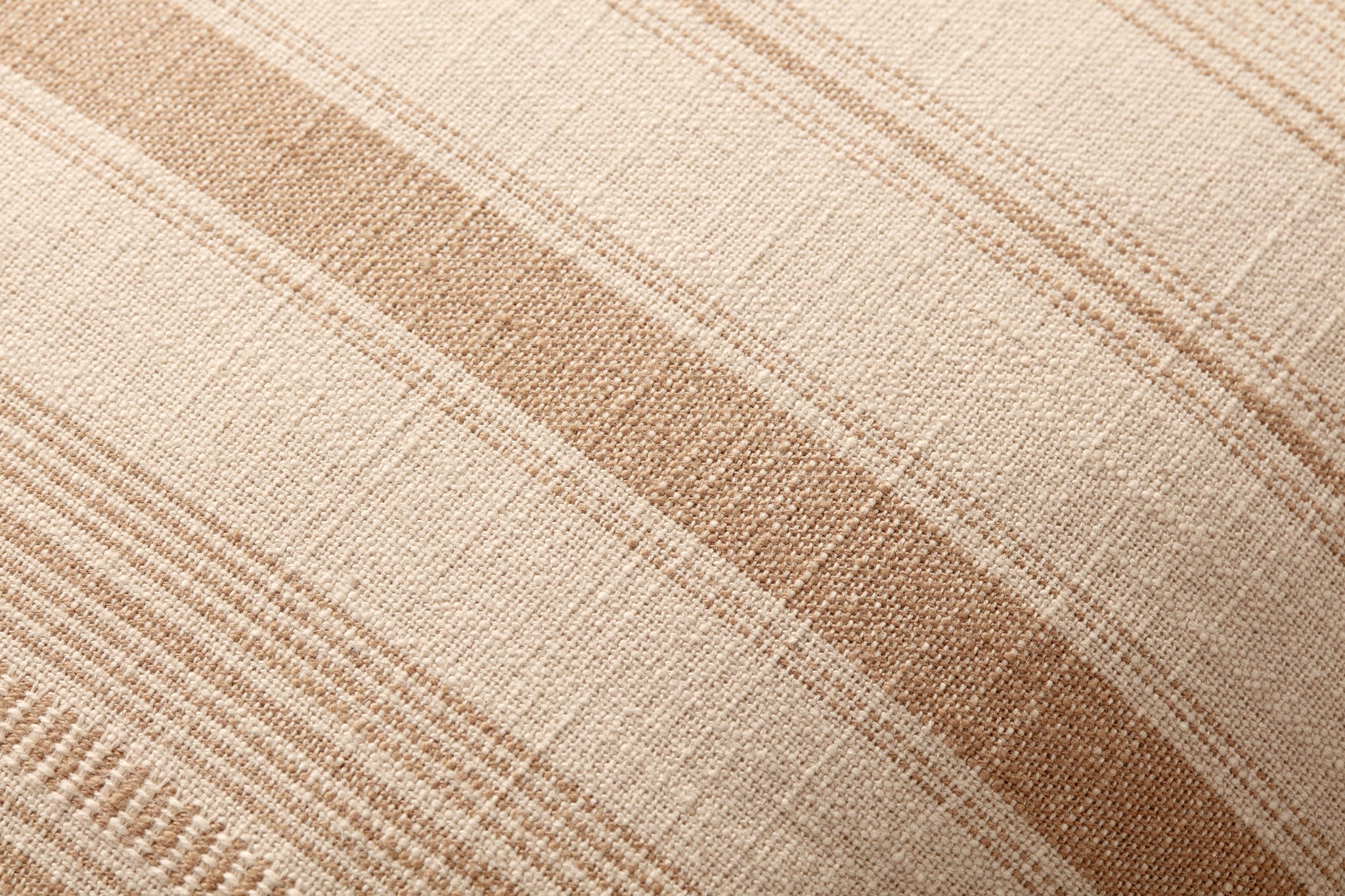Celina Ivory / Wheat Pillow shown from a different angle to reveal its pattern.