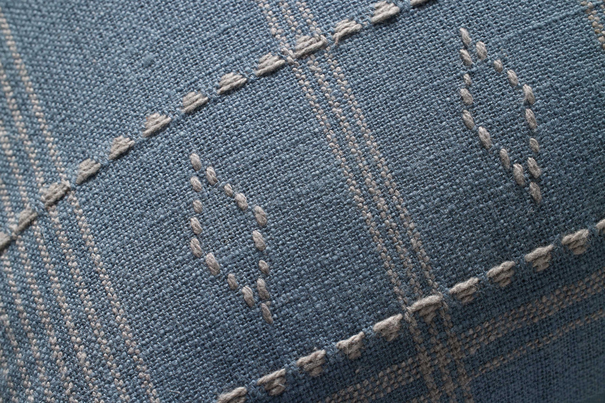 Lina Blue / Slate Pillow shown from a different angle to reveal its pattern.