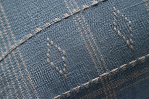 Lina Blue / Slate Pillow shown from a different angle to reveal its pattern.